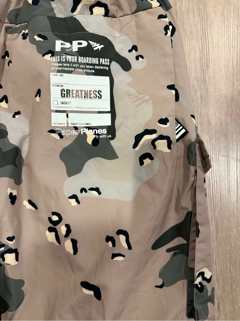Paper Planes multi-pocket cargo pants featuring an all-over camouflage print